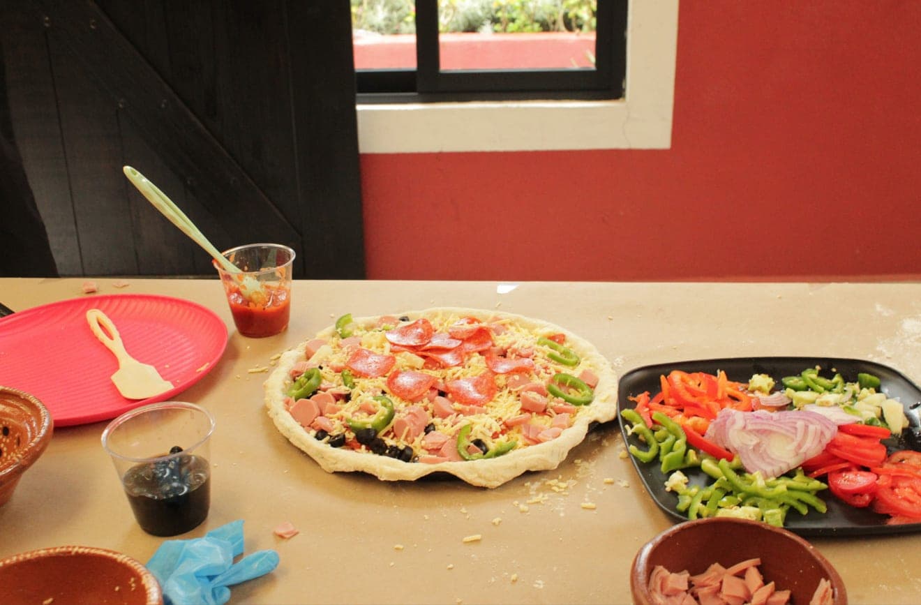 Talleres de pizza artesanal en hornos tradicionales